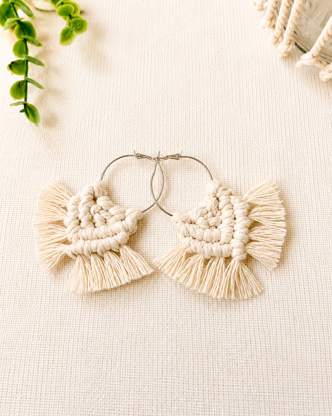 Handmade off white macrame chevron hoop earrings with silver hoops and soft cotton fringe.