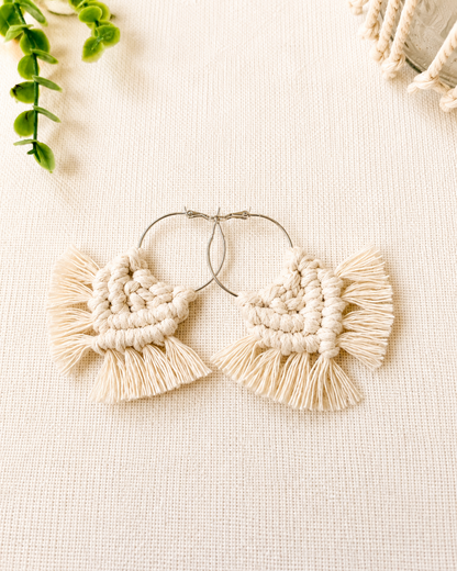 Handmade off white macrame chevron hoop earrings with silver hoops and soft cotton fringe.