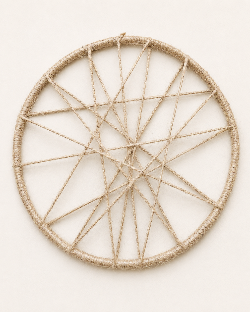 Handmade 20 cm open jute circle wall decor with abstract woven cord design
