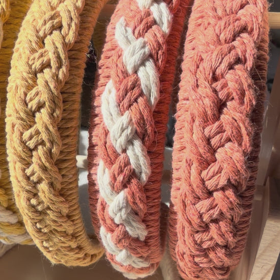 Handmade macrame braided headbands in multiple colours displayed together