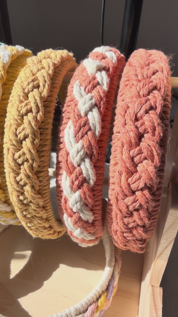Handmade macrame braided headbands in multiple colours displayed together