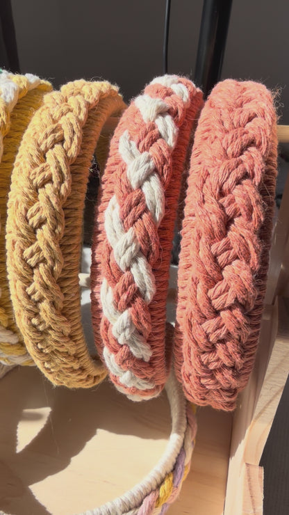 Handmade macrame braided headbands in multiple colours displayed together