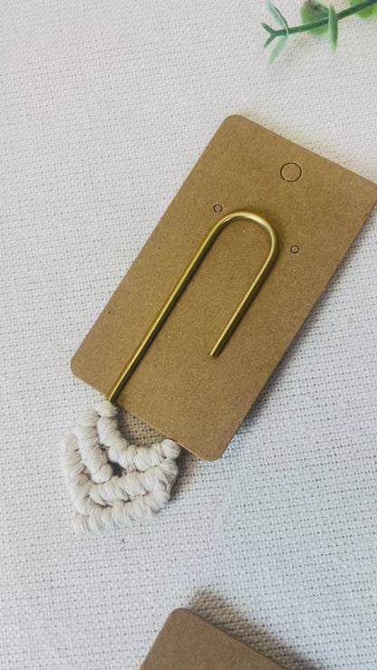 Handmade macrame heart bookmark displayed on its kraft backing card