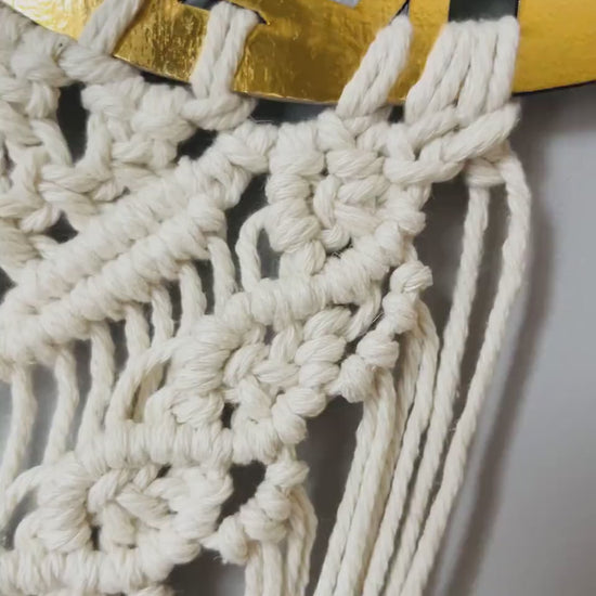 Video showcasing the handmade Ramadan Kareem macrame crescent wall hanging from different angles.
