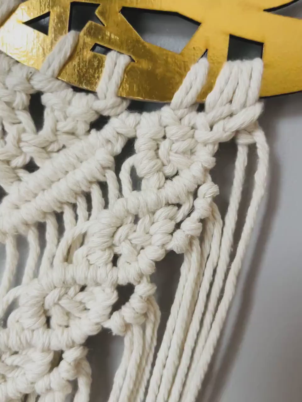 Video showcasing the handmade Ramadan Kareem macrame crescent wall hanging from different angles.