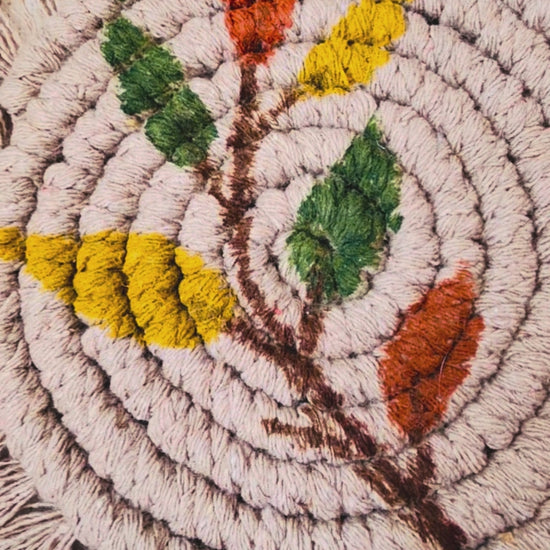 Boho floral macrame coasters set of 2 handmade from cotton cord with fringe, styled with a coffee mug for cosy boho home decor.