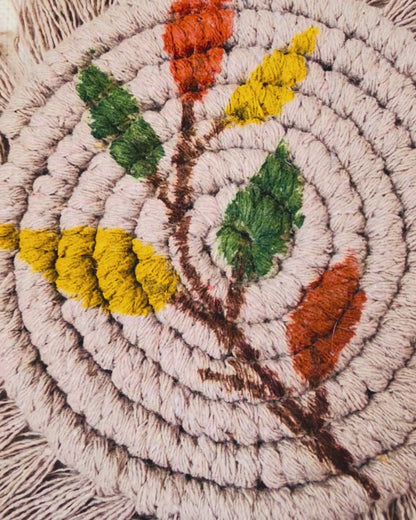 Boho floral macrame coasters set of 2 handmade from cotton cord with fringe, styled with a coffee mug for cosy boho home decor.