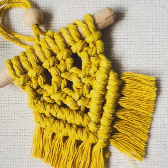 Handmade mini macrame Christmas ornaments in off white, mustard, sage green and light brown