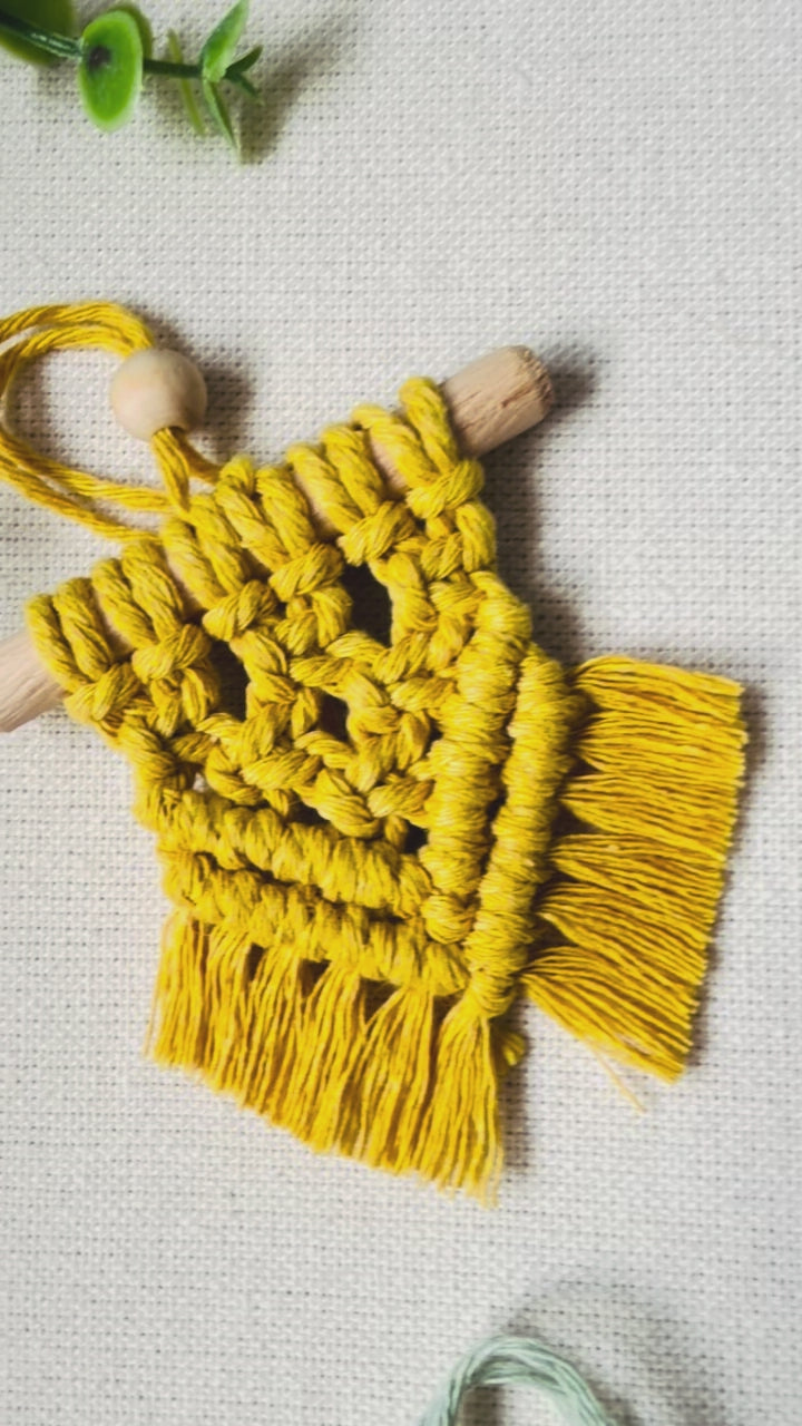 Handmade mini macrame Christmas ornaments in off white, mustard, sage green and light brown