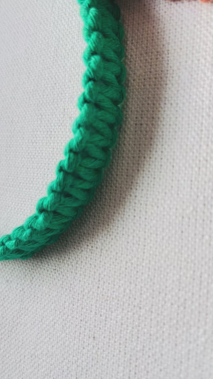 Video showing handmade macrame square knot headbands in multiple colours with close-up views of the textured knot design and comfortable fit.