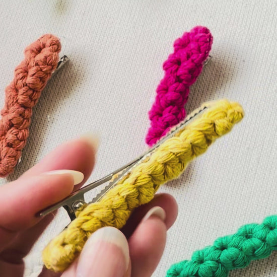 Demonstration of the secure French barrette clip on the handmade macrame hair clip.