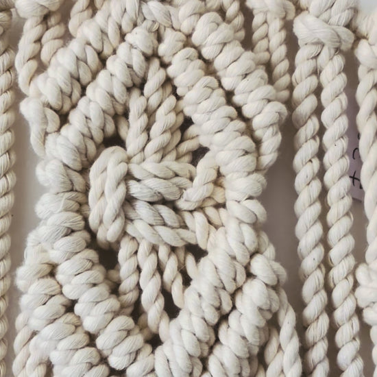 Video showing the handmade Diamond macrame star wall hanging and textured knot details