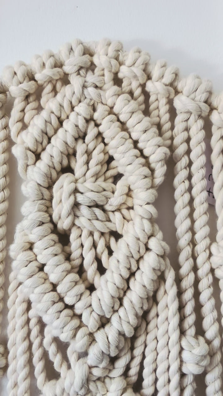 Video showing the handmade Diamond macrame star wall hanging and textured knot details