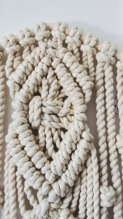 Video showing the handmade Diamond macrame star wall hanging and textured knot details