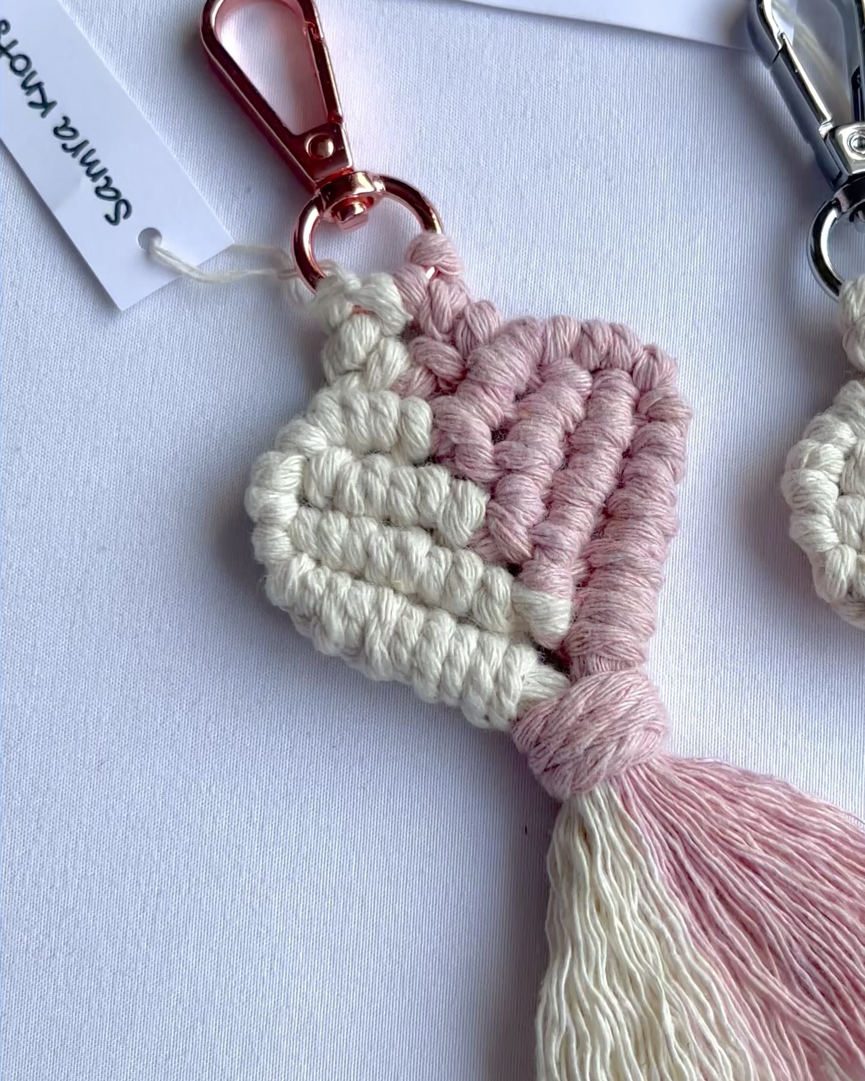 Showcase of handmade macrame heart keyrings in multiple colours with tassels, cotton bag charms and thoughtful handmade gifts.