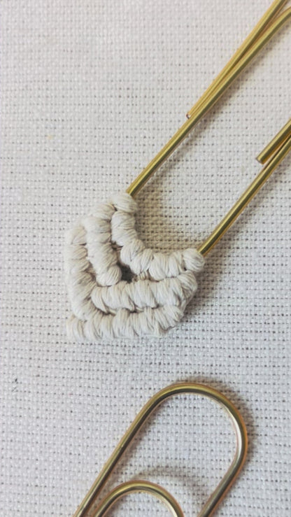 Close-up video showing the handmade knots on a macramé heart bookmark