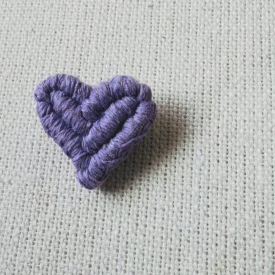 Video showing handmade lilac macrame heart brooch from different angles