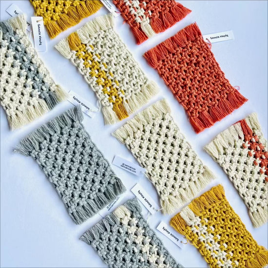Showcase of handmade macrame mug rugs in mustard, terracotta and off-white colors.