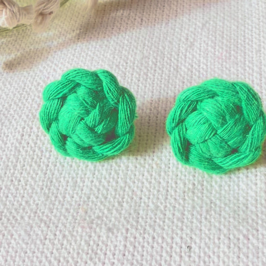 Video showing handmade macramé flower stud earrings available in multiple colours.