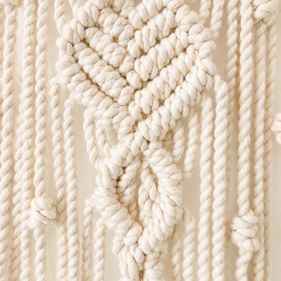 Close-up video showing Egyptian cotton knots on handmade crescent moon wall hanging