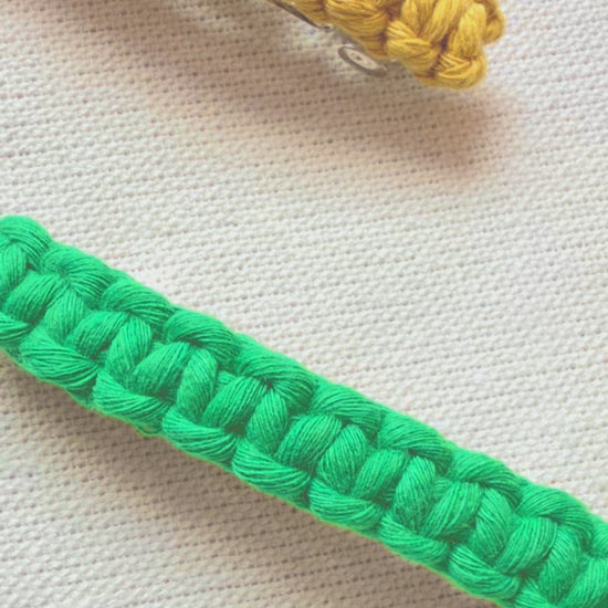 Handmade macramé hair clips displayed in different colours and angles