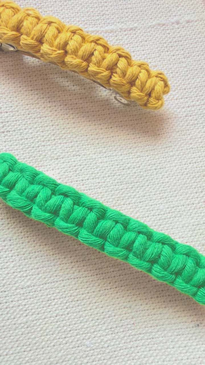 Handmade macramé hair clips displayed in different colours and angles
