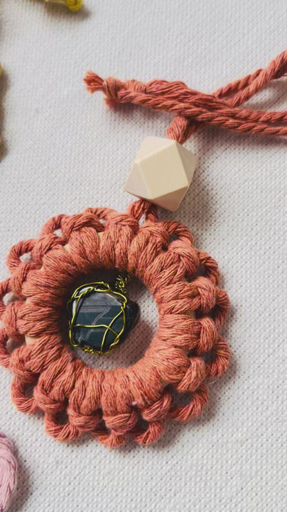 Video showcasing handmade macrame car charms with genuine natural gemstones and unfinished wooden essential oil diffuser beads in five colour options.
