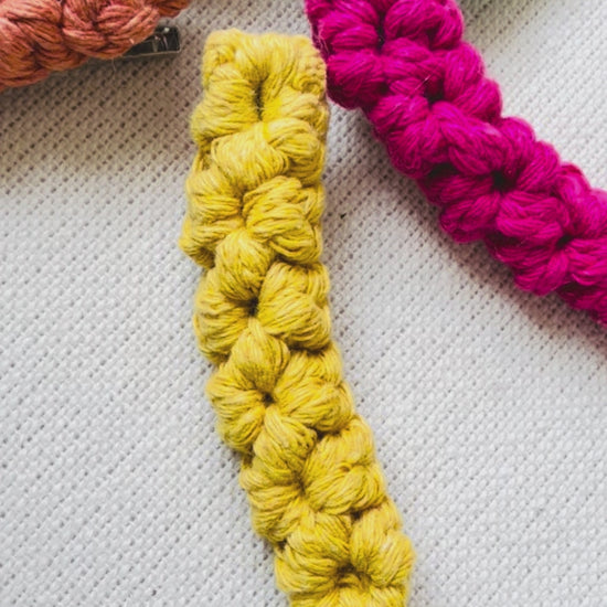 Handmade macrame hair clips available in six colour options.