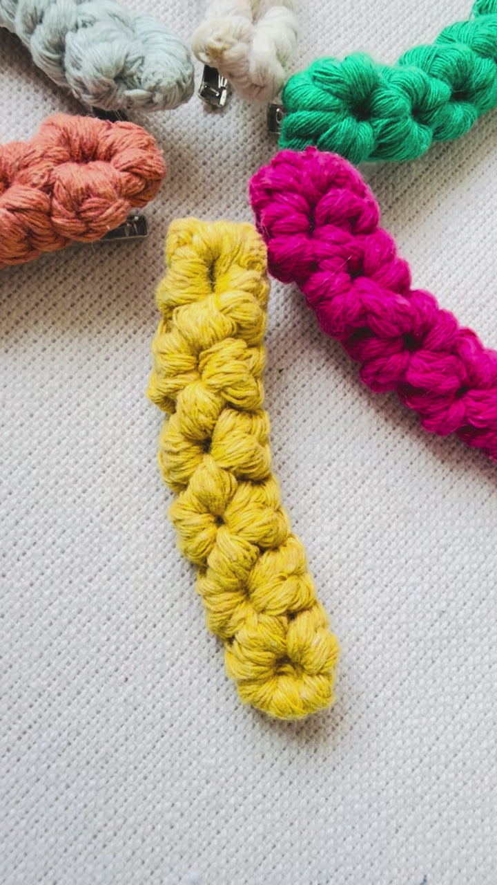 Handmade macrame hair clips available in six colour options.