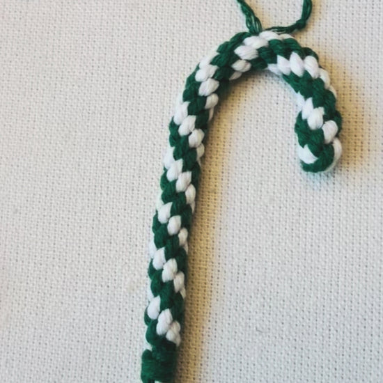 Handmade macrame candy cane Christmas ornaments in burgundy, mustard and green with cream