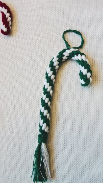 Handmade macrame candy cane Christmas ornaments in burgundy, mustard and green with cream