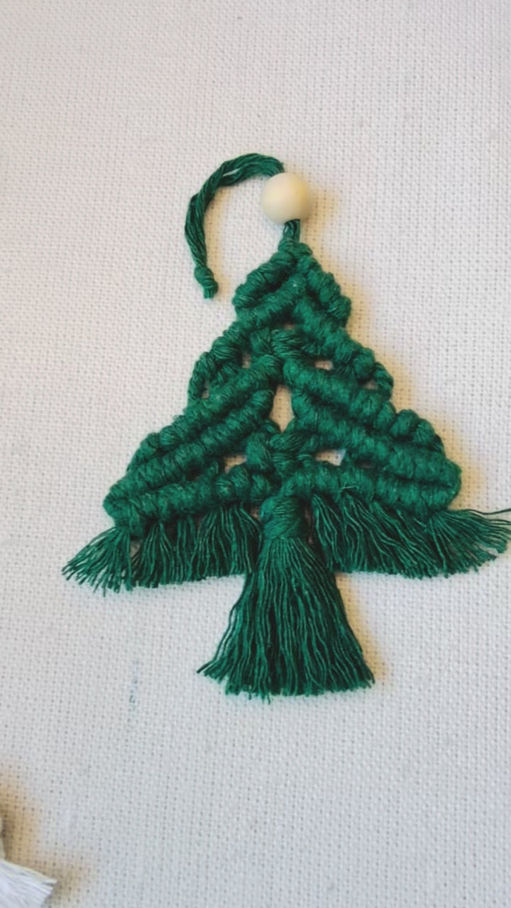 Handmade green macrame Christmas tree ornament showing the knotted details