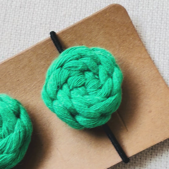 Handmade macrame button hair ties available in off white, mustard, terracotta, sage green, emerald green and hot pink.