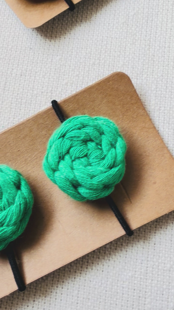 Handmade macrame button hair ties available in off white, mustard, terracotta, sage green, emerald green and hot pink.