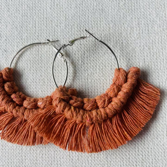 Video showing handmade macrame fringe hoop earrings, colours and details.