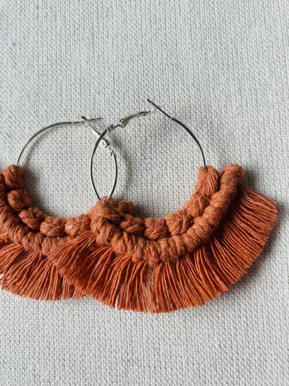 Video showing handmade macrame fringe hoop earrings, colours and details.