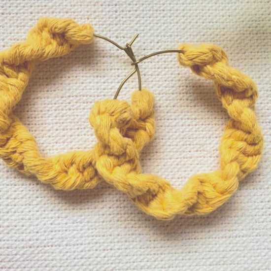 Video showing handmade macramé hoop earrings from different angles