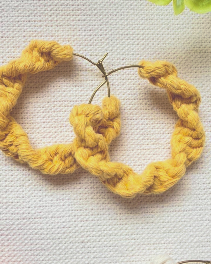Video showing handmade macramé hoop earrings from different angles