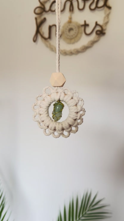 Video showing a handmade macrame gemstone car charm and essential oil diffuser from different angles.