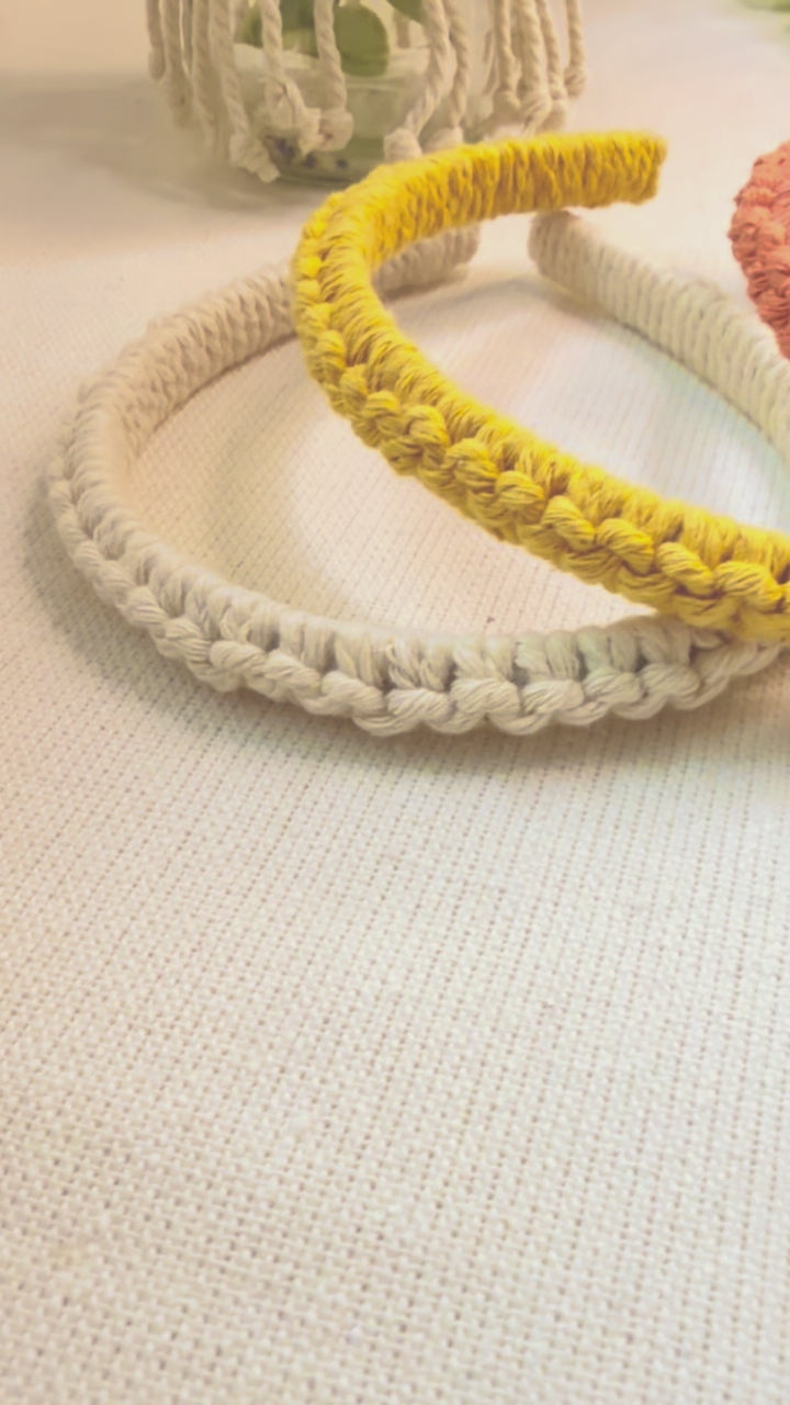 Video showing handmade cotton macramé headband from different angles.