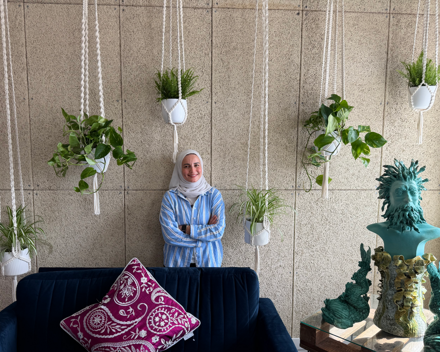 Samra Knots maker with the completed macrame plant hanger installation at Harmonic Haven