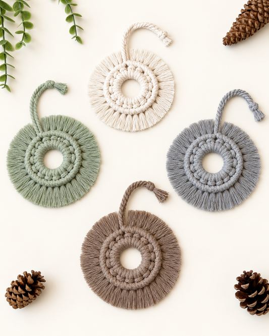 Handmade round macrame Christmas ornaments in off white, sage green, grey and taupe