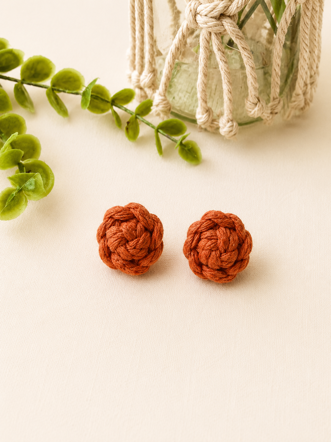 Terracotta handmade macramé flower stud earrings inspired by boho style.