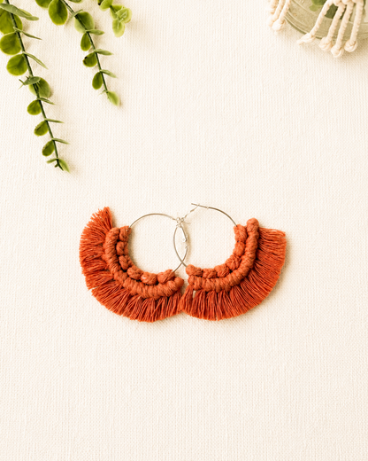 Handmade terracotta macrame fringe hoop earrings with stainless steel hoops.